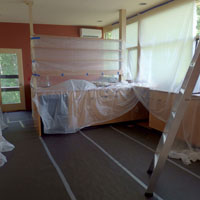 Here's the kitchen all emptied out and all of the surfaces covered, in anticipation of the onslaught