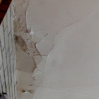 The reason for the whole thing: perpetually peeling plaster and water damage around the chimney