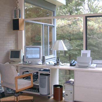 Dave's office, from whence all of this electronic drivel cometh. Lots of bookshelves to the right and a fireplace to the left of the pic (for the third and final time).