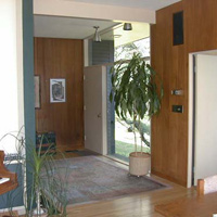 The front door, on the back of the house again. If you walk toward the front door and take a left and then a right, you enter the T-shaped wing on the back of the house headed for the bedrooms.