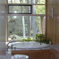 The front bath, with Jacuzzi and view of the back yard. Both baths were as original when we bought the house and we had them done over. This one is in cherry.