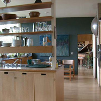 The kitchen looking right, standing in the doorway mentioned above. We had the original oak cabinets refinished. Pretty '50s, eh?
