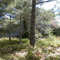 Halfway up the driveway, you can see the right side of the house (as viewed from the inside). Another boring photo - they get a little better.