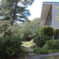 Stone walk leads up to the flagstone patio on the front of the house, with sliders into the LR. The entrance we usually use is on the side of the house, off to the right of this pic, and goes into the kitchen.