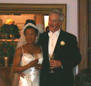 Felecia and Mike listen to the toast